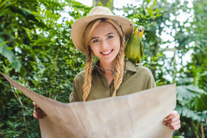 attractive-young-woman-in-safari-suit-with-parrot-2024-11-15-09-06-45-utc
