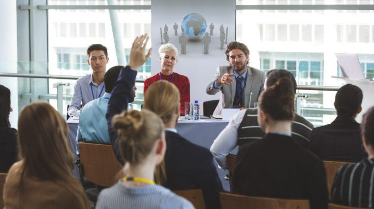 businessman-raising-handat-business-seminar-in-off-2023-11-27-05-20-19-utc