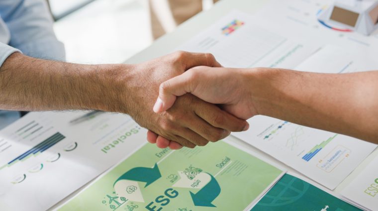 closeup-asia-businesspeople-shaking-hands-over-esg-2024-11-02-10-44-52-utc