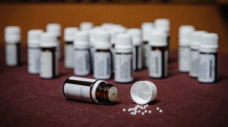 closeup-shot-of-small-glass-bottles-of-pills-on-th-2025-02-11-23-51-52-utc