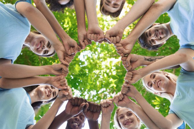 group-of-people-fist-bump-assemble-together-2025-03-18-17-41-08-utc