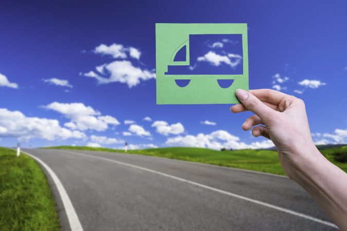 hand-holds-green-logistics-symbol-2024-12-06-21-00-31-utc