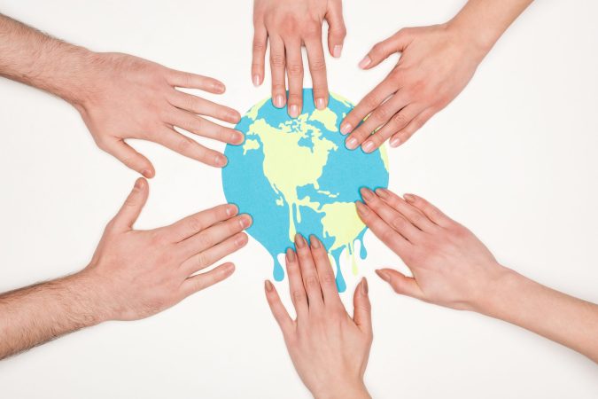 partial-view-of-women-and-men-putting-hands-on-pap-2024-11-12-02-26-10-utc