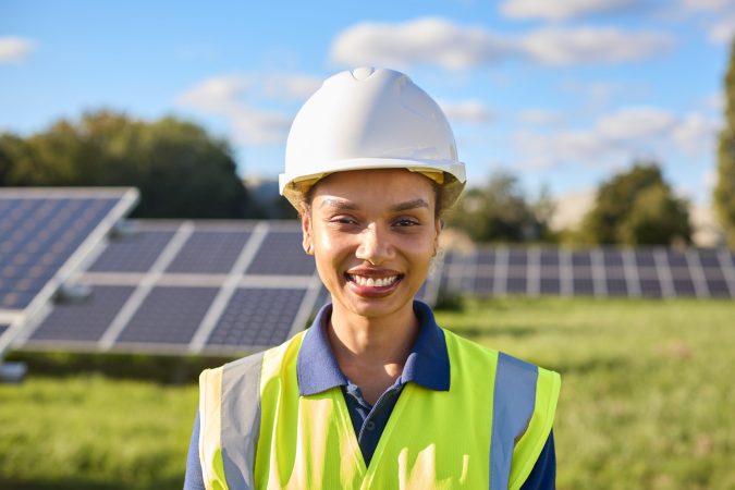 portrait-of-female-engineer-inspecting-solar-panel-2024-10-19-13-30-22-utc