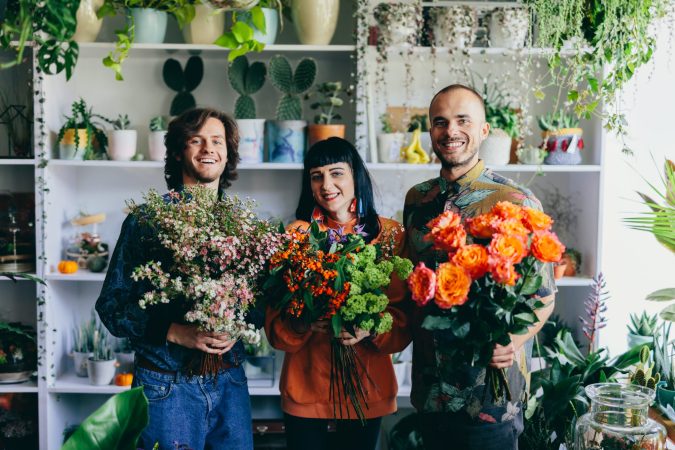team-of-florist-work-in-flower-store-with-teamwork-2025-03-24-14-48-23-utc